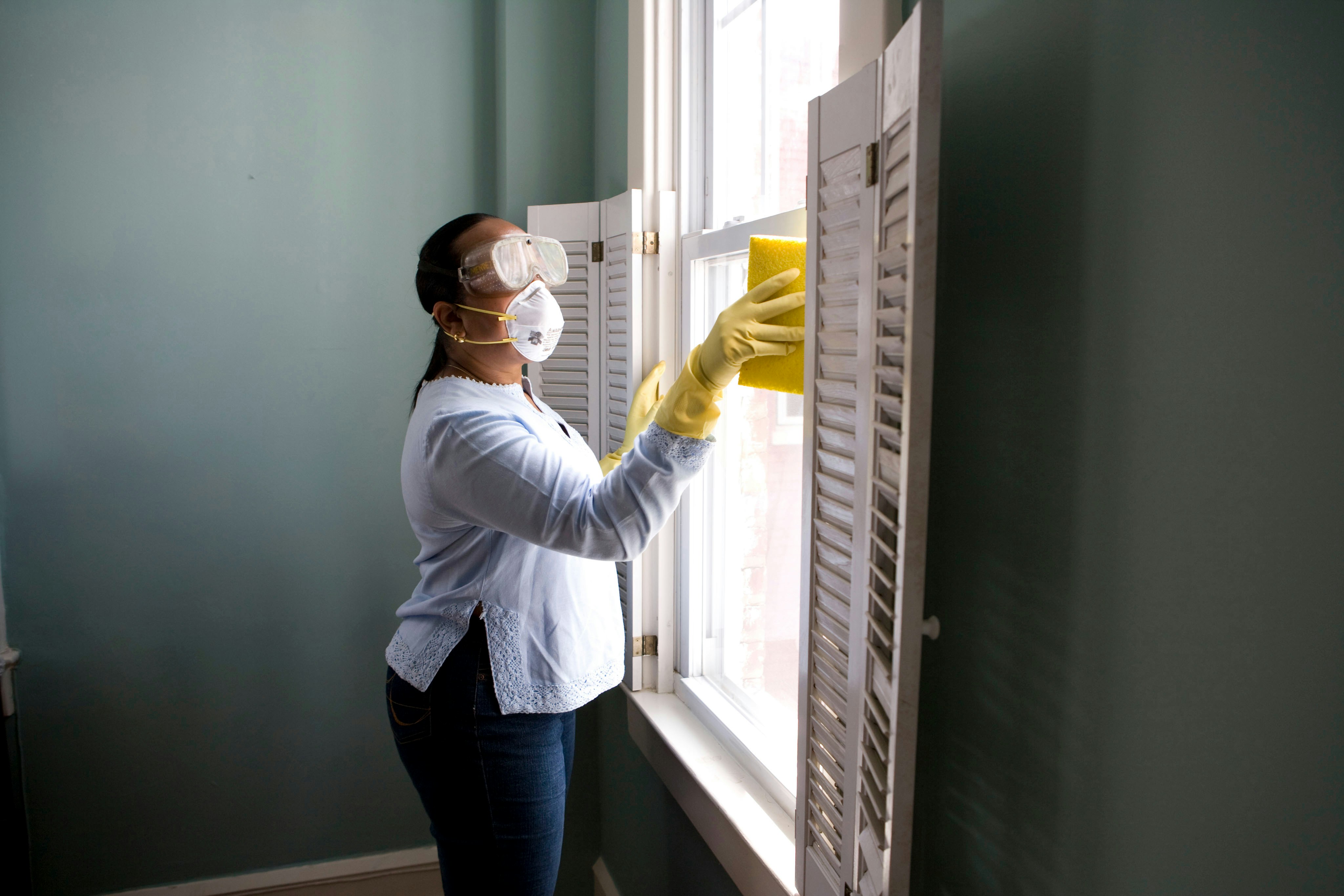 Cleaning lady cleaning a window